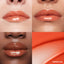 Lip macros of three skin tones wearing the MoistureGlow™ Plumping Lip Serum in shade Tangerine Glow.