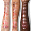 Arm swatch on three skin tones showing all shades of MoistureGlow™ Plumping Lip Serum.